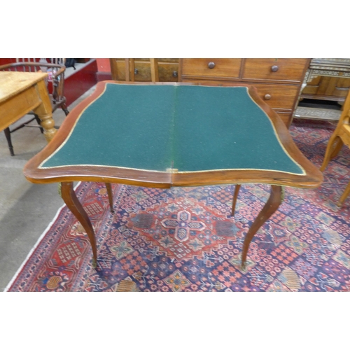 11 - A French Louis XV style marquetry inlaid rosewood and gilt metal mounted serpentine card table