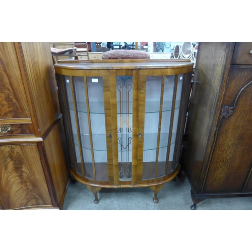 110 - A walnut two door display cabinet