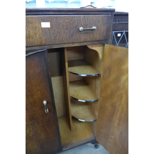 111 - An Art Deco oak tallboy