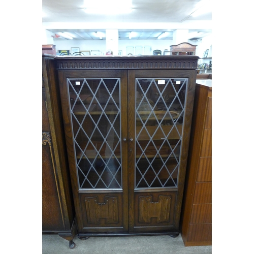 112 - A carved oak linenfold bookcase