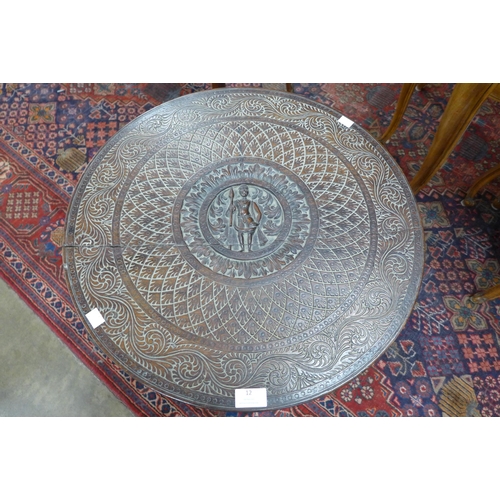 12 - An early 20th Century African carved hardwood occasional table