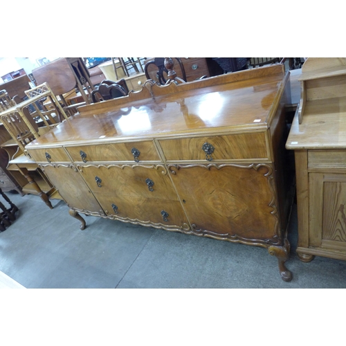 121 - A Queen Anne style walnut sideboard