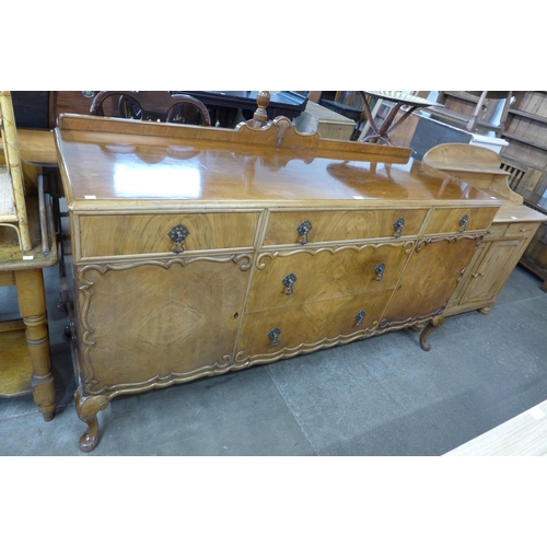 121 - A Queen Anne style walnut sideboard