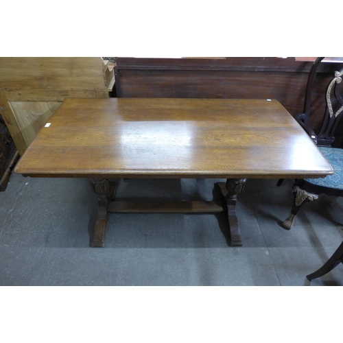 136 - A carved oak refectory table