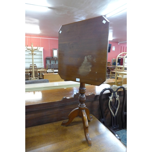 140a - A Victorian walnut octagonal tilt-top tripod table