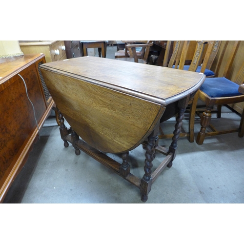 144 - An oak barleytwist gateleg table