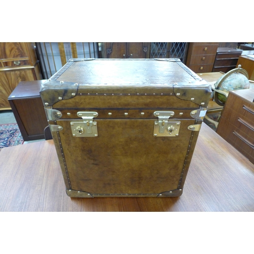 15 - A brown leather and brass mounted trunk