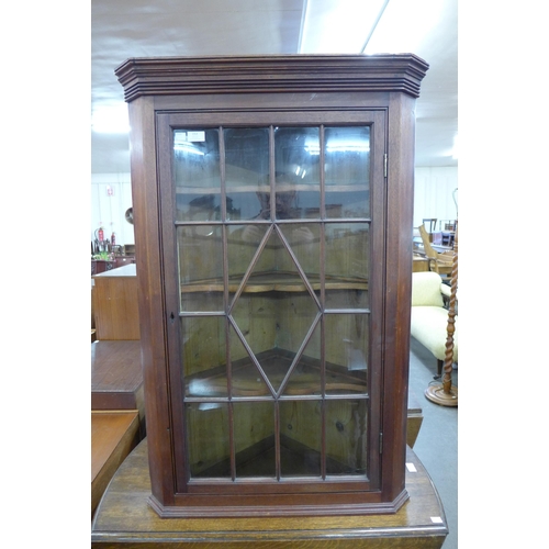 153 - A Victorian mahogany splay front wall hanging corner cabinet