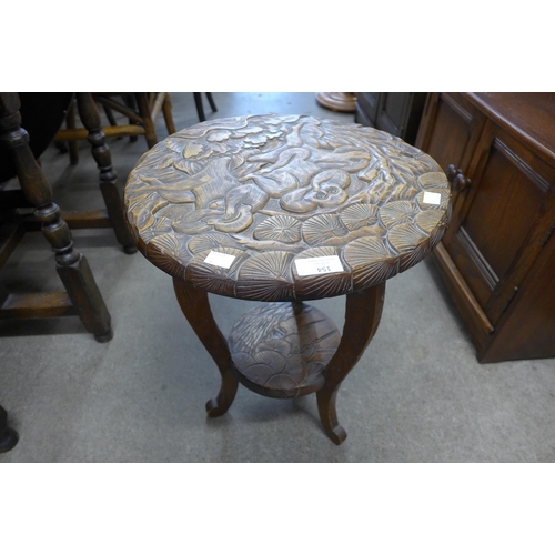 154 - An eastern carved softwood occasional table