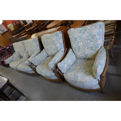 172 - An Ercol Golden Dawn elm and beech Renaissance settee and two armchairs