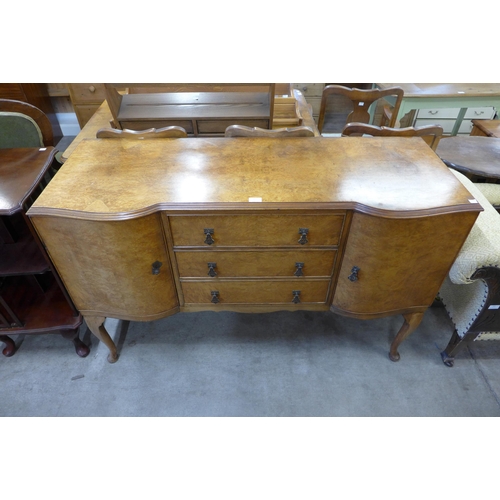 186 - A Queen Anne style burr walnut serpentine sideboard