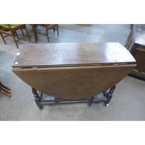 19 - A George II oak single drawer gateleg table