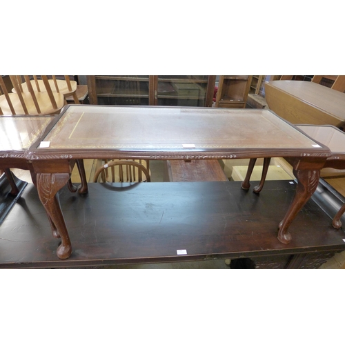 205 - A mahogany and leather topped nest of tables