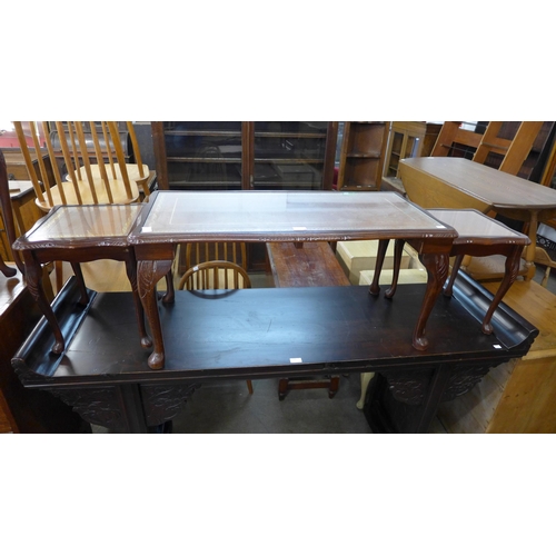 205 - A mahogany and leather topped nest of tables