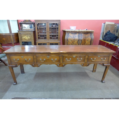 21 - A George II style yew wood dresser, 76cms h, 212cms w, 54cms d