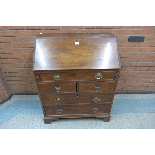 210a - A George III mahogany bureau