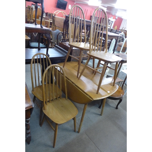 214 - An oak  drop-leaf table and four chairs