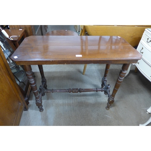 218 - A Victorian walnut stretcher table