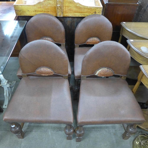 220 - A set of four Art Deco oak and faux leather chairs