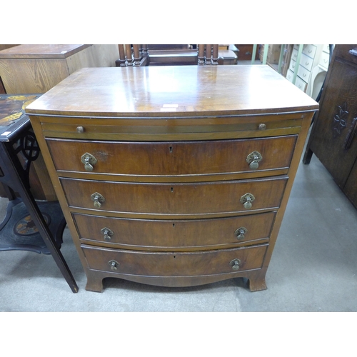 226 - A George III style walnut bow front chest of drawers