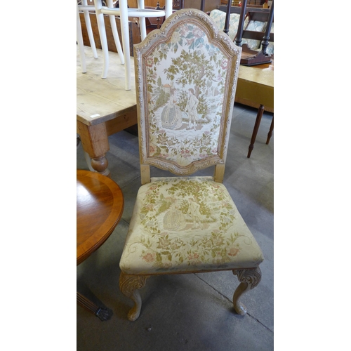 238 - An oval yew wood coffee table and a French painted chair