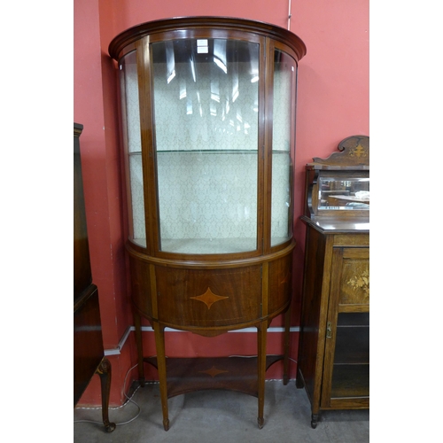 27 - An Edward VII inlaid mahogany bow front display cabinet