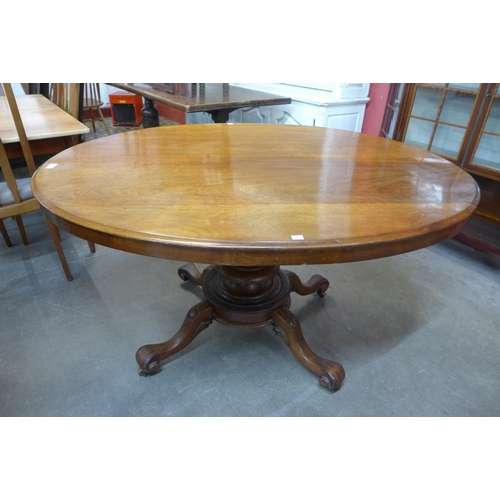 31 - A Victorian mahogany oval tilt top centre table