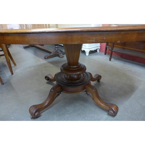 31 - A Victorian mahogany oval tilt top centre table