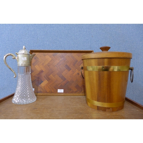 432 - A teak tray, a teak ice bucket and a claret jug