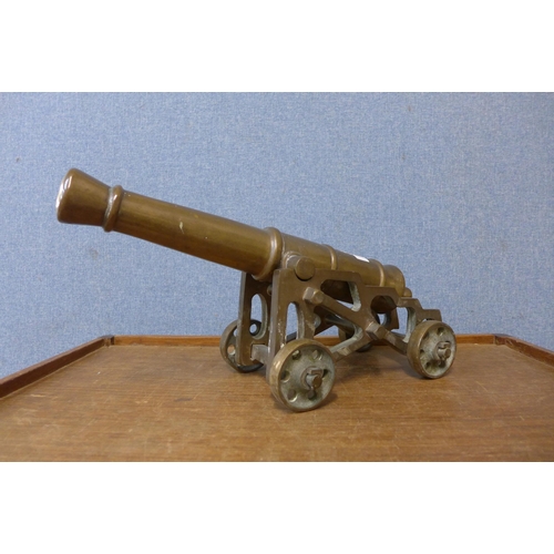 438 - A cast bronze table top cannon