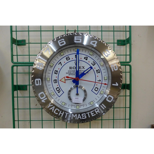 440 - A Rolex style dealer's display wall clock