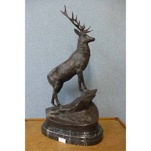 453 - A French style bronze figure of a stag, on black marble plinth