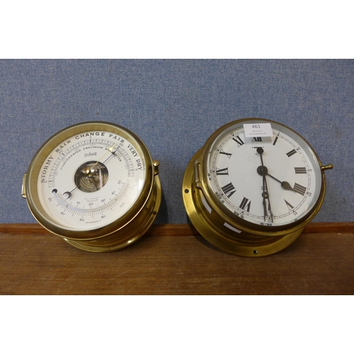 461 - A Stockburger brass ship's barometer and an Elliott brass ship's clock