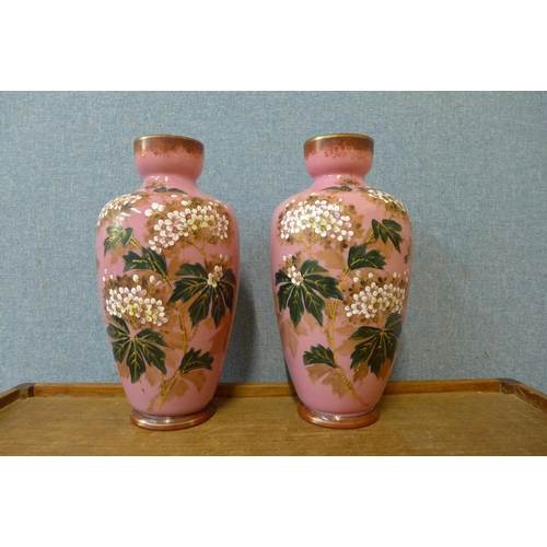 463 - A pair of Victorian painted pink glass vases