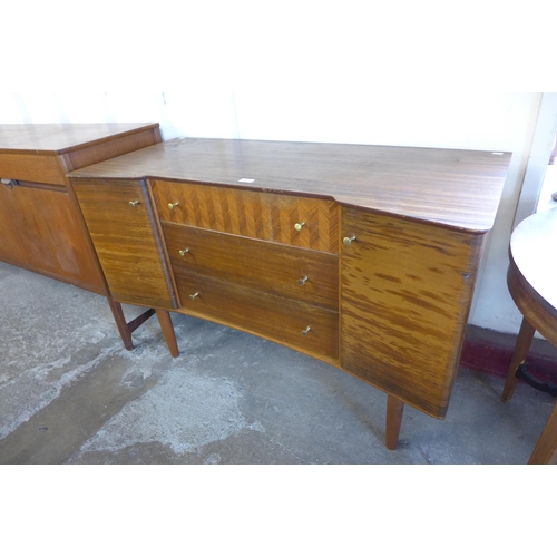 53 - A Uniflex walnut concave sideboard