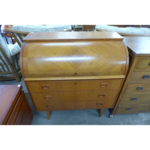 57 - A Swedish SMI teak cylinder bureau, designed by Egon Ostergaard