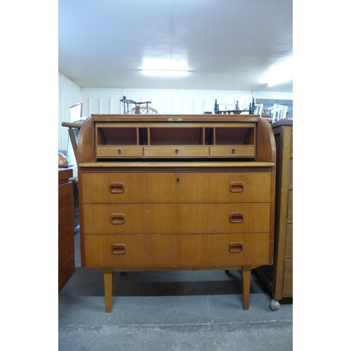 57 - A Swedish SMI teak cylinder bureau, designed by Egon Ostergaard