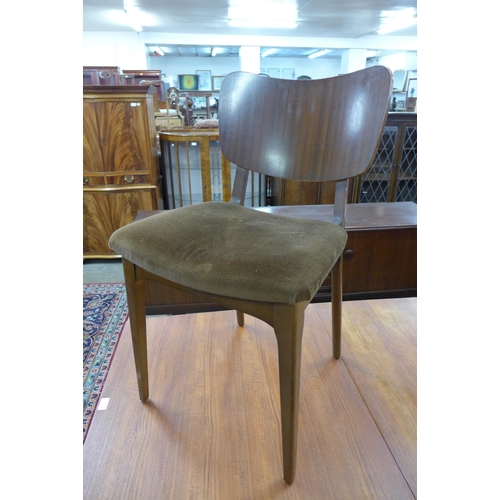 62 - A set of four teak dining chairs