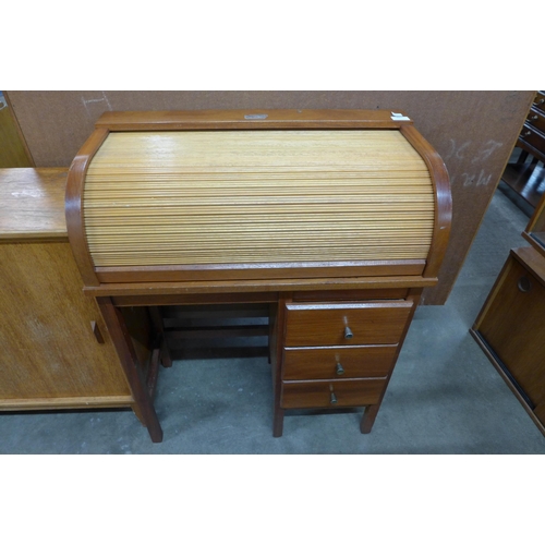 93 - A child's teak tambour roll-top desk