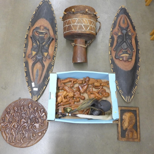 1143 - An African tribal wooden figure, carvings, shields, bongo drum, etc.**PLEASE NOTE THIS LOT IS NOT EL... 