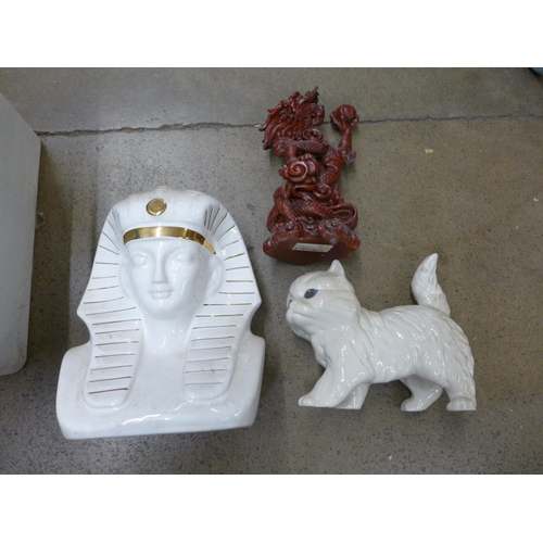 1168 - Two resin models of dragons, a resin model of a fish, a ceramic cat and Pharoah's head, a pair of fi... 