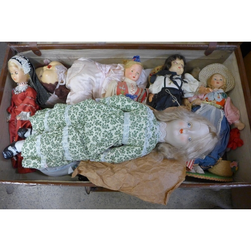 1188 - Two suitcases of dolls, a Rosebud Wonder baby doll, boxed, a Windermere & Bowness doll kit, a black ... 