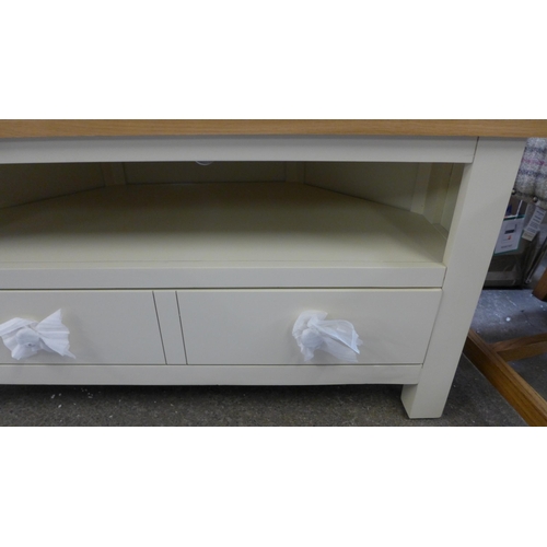 1414 - A Salisbury cream painted and oak corner tv unit  *This Lot is Subject to VAT*