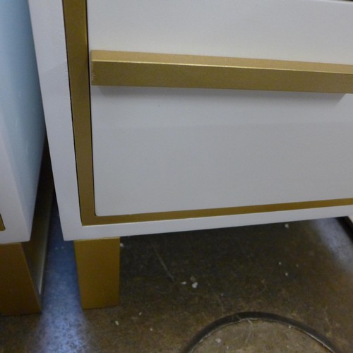 1433 - A white two drawer bedside chest with gold legs