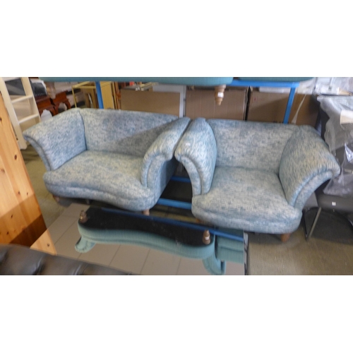 1741 - A teal and cream two seater sofa and armchair