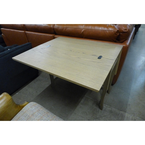 1387 - A metamorphic washed oak console/dining table