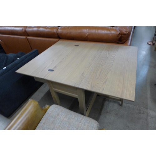 1387 - A metamorphic washed oak console/dining table