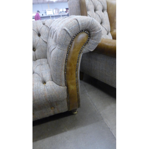 1462 - A Chesterfield Harris tweed and cerato leather three seater sofa