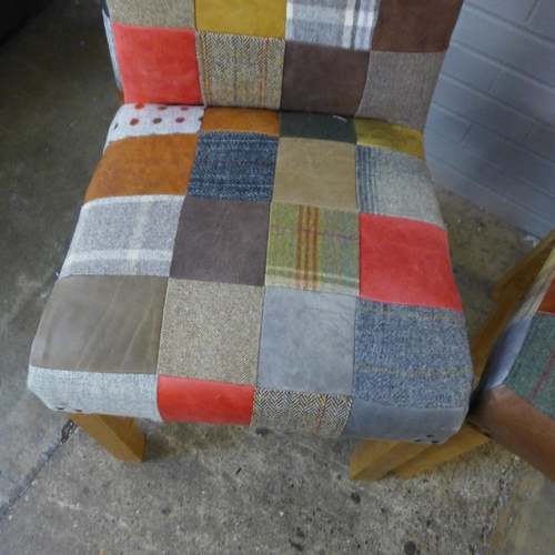 1476 - A pair of patchwork and leather rollback chairs - some damage