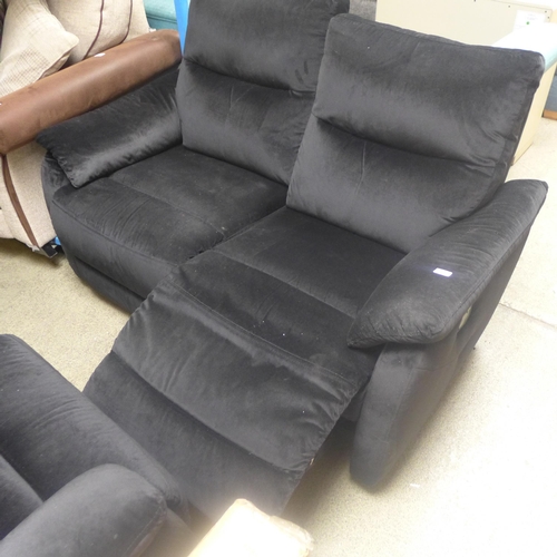 1730 - A black velvet upholstered two seater sofa and armchair, both manual recliners